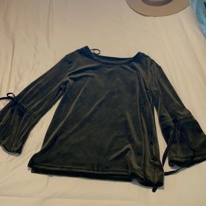 Dark green velour long sleeve shirt with black bow detail on sleeves.